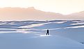 A female in black clothing admiring the view of mountains at White Sands National Park