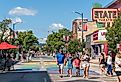 Busy Front Street in downtown with State Street Theater, Traverse City, Michigan. Image credit Heidi Besen via Shutterstock