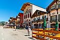 Shops and sidewalk cafes line the quaint Bavarian themed main street of Leavenworth, Washington. Image credit Kirk Fisher via Shutterstock