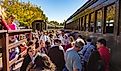 Tourists preparing to board the he Connecticut Valley Railroad Company operates the Essex Steam Train. Editorial credit: Bob Pool / Shutterstock.com