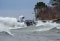 Lake Superior waves with a Great Lakes ore boat on the horizon.