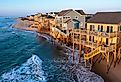 Aerial view of homes on the shoreline during high tide in Buxton, North Carolina, Outer Banks.