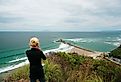 Tourists and local people visit Mangawhai Head Beach in the Northland region, New Zealand. Editorial credit: Handoko Kurniawan / Shutterstock.com