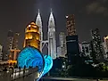 The iconic Petronas Twin Towers light up Kuala Lumpur’s skyline. Photo credit: Andrew Douglas