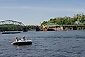 View from the river of the Rocks Village Bridge, which crosses the Merrimack River at West Newbury, Massachusetts, By kathryn from New York City - IMG_2014, By kathryn from New York City - IMG_2014, CC BY 2.0, https://commons.wikimedia.org/w/index.php?cur