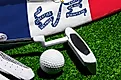 Golf ball, club and flag of Iowa for a golf championship in Iowa. Via Shutterstock / Bermix Studio.