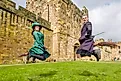 Two participants learn how to ride a broom and play quidditch at the Alnwick Castle. Credit: Bryan Dearsley