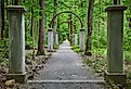 Row of concrete pillars and metal arches on Rose Island, Indiana