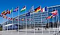 The national flags of countries member of the NATO fly outside the organisation headquarters in Brussels, Belgium.