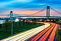 Verrazano Narrows Bridge above the light trails of the Belt Parkway traffic, at dusk. Credit: Mihai_Andritoiu / Shutterstock