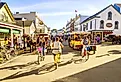 Vacationers take on Market Street in Mackinac Island, Michigan. Image credit Alexey Stiop via Shutterstock