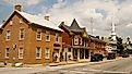 Street view of downtown Funkstown, Maryland, featuring historic brick buildings, small businesses, and tree-lined sidewalks. By Acroterion, CC BY-SA 3.0, https://commons.wikimedia.org/w/index.php?curid=7275466