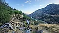 A scenic view of Lake Kaweah and the surrounding golden hills near Three Rivers, California, showcasing the dry lakebed and the winding Kaweah River under the Sierra Nevada foothills. Credit: jrwynam/Shutterstock.com