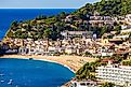 Modern town of Tossa de Mar viewed from the old town’s ramparts, Spain. 
