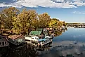 Winona, Minnesota USA October 12, 2022 Houseboats on Latsch Island in the backwaters of the Mississippi River on an autumn morning, taken from the Latsch Island Bridge in Winona, Minnesota USA.