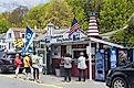 People lined up outside of Dunton's Doghouse hot dog stand in the town of Boothbay Harbor Maine.