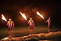 Three Maui Men Juggling Fire in Hawaii
