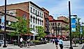 Ithaca, the home of Cornell University, has a lively downtown with shopping and restaurants, including this pedestrianized street. Editorial credit: Spiroview Inc / Shutterstock.com