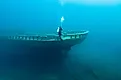 A diver inspects the bow of the wreck of the steel bulk freighter Grecian, where it rests in Lake Huron's Thunder Bay National Marine Sanctuary.