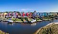 Facade of colorful houses along the bay in Navarre, Florida.