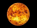 Venus experiences extremely high temperature due to its thick atmosphere.