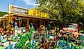 Colorful shop with artwork on display in the small Texas Hill Country town of Wimberley, Texas. Image credit Fotoluminate LLC via Shutterstock