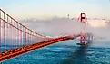 Golden Gate Bridge shrouded in fog overlooking the bay in San Francisco