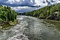 Beautiful and Mighty Glomma River in Norway. Scenic view of the biggest Norwegian river during summer day. Image credit designium via Shutterstock. 