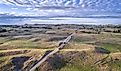 Aerial view of sandy road in Nebraska Sandhills near Seneca, spring scenery with morning light