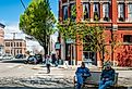 Older men sitting on a bench on Water Street in Historic Port Townsend, Washington. Image credit Gareth Janzen via Shutterstock