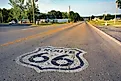 U.S. Route 66 highway, with sign on asphalt on Missouri. 