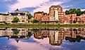 Augusta, Maine, skyline on the Kennebec River at twilight.