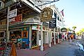 Local businesses in downtown Key West, Florida. Editorial credit: Dennis MacDonald / Shutterstock.com.