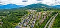 Snoqualmie Ridge, Washington, USA - Aerial overview of suburban neighborhood and forest community housing development. 