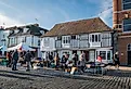 Market stalls in the medieval town of Faversham, Kent, UK. Image credit: Sue Martin via Shutterstock.