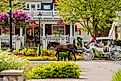 Horse-drawn carriage transports tourists in downtown Frankenmuth, Michigan. Image credit arthurgphotography via Shutterstock