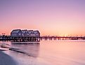 Busselton Jetty stretching into the ocean at sunset in Western Australia
