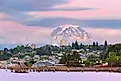 Mount Rainier over Tacoma Washington waterfront during alpenglow sunset evening