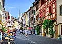 Tourists walking at the main street of the beautiful village of Stein am Rhein, Switzerland. Editorial credit: puyalroyo / Shutterstock.com