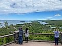 Motorist pull over at Brockway Mountain Lookout to admire the rugged beauty of the Keweenaw Peninsula and its northernmost community, Copper Harbor