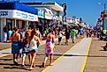 Folks enjoy a sunny summer’s day on the boardwalk in Wildwood, New Jersey.