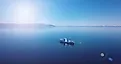 Aerial view of a ship floating in the water. Lake Baikal. Blue water.