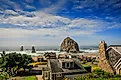 Seaside homes in Cannon Beach, Oregon, with the Haystack Rock in the background.