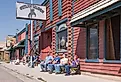 Group of people watching the solar eclipse in front of the Outlaw Saloon in Dubois, Wyoming. Image credit Sandra Foyt via Shutterstock