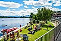 Beach at Mirror Lake in Lake Placid, upstate New York, with tourists and boat rentals. Image credit Leonard Zhukovsky via Shutterstock.