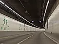 Seattle SR 99 Tunnel Interior Roadway with Curving Lanes and Emergency Exit Signs