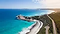 White sand beach and clear blue water in Esperance, Western Australia, under a bright blue sky.
