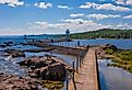 Grand Marais Lighthouse against the backdrop of the Sawtooth Mountains on Lake Superior.