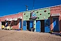 Tucumcari, New Mexico - September 6, 2020: Sunlight at the laundry room and neon signs at the historic Blue Swallow Motel on Route 66. Editorial credit: Logan Bush / Shutterstock.com