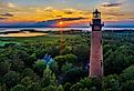 Aerial view of Currituck Beach Lighthouse at sunset near Corolla, North Carolina.